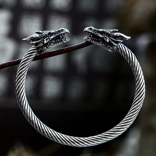 Silver Viking arm ring featuring Old Norse dragon and serpent motifs