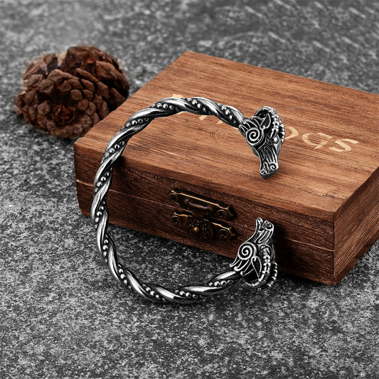Intricately crafted stainless steel Viking arm ring featuring terminals shaped like Thor's legendary goats, inspired by Norse mythology and Viking heritage.